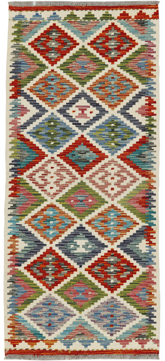 Afghan Kilim runner rug by eastofhere, 144x63cm with traditional geometric patterns and vibrant colors on woven fabric.