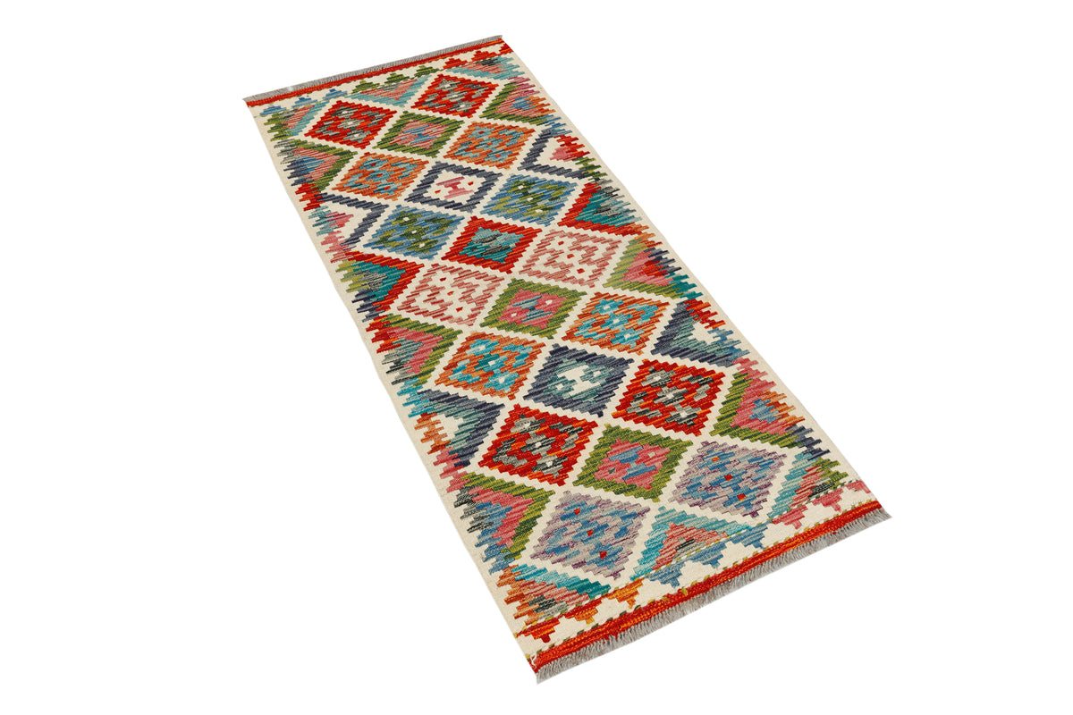 Afghan Kilim runner rug by eastofhere, 144x63cm, featuring traditional geometric patterns and vibrant colors on a woven textile.