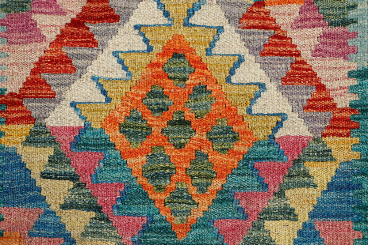 Afghan Kilim runner rug by eastofhere, 200cm x 67cm, featuring vibrant geometric patterns and traditional woven design.