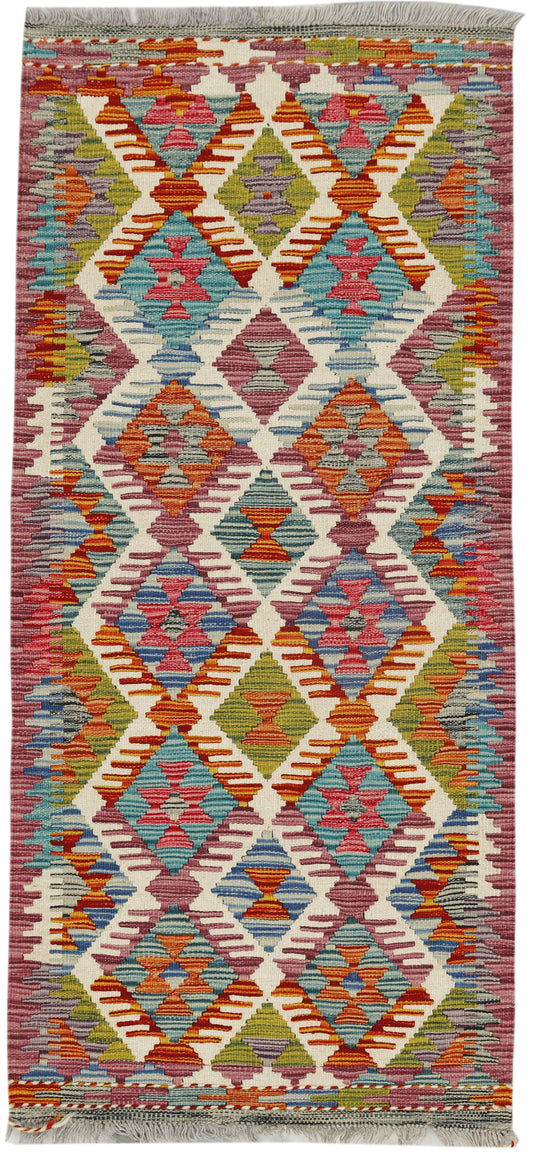 Afghan Kilim runner rug by eastofhere, 142x64cm, featuring colorful traditional geometric patterns on woven textile.