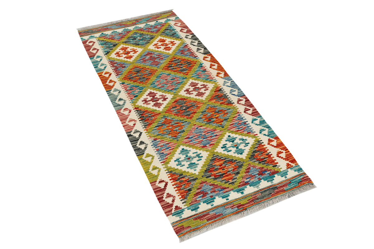 Afghan Kilim runner rug by eastofhere, 149x65cm, featuring traditional geometric patterns and vibrant colors on woven fabric.