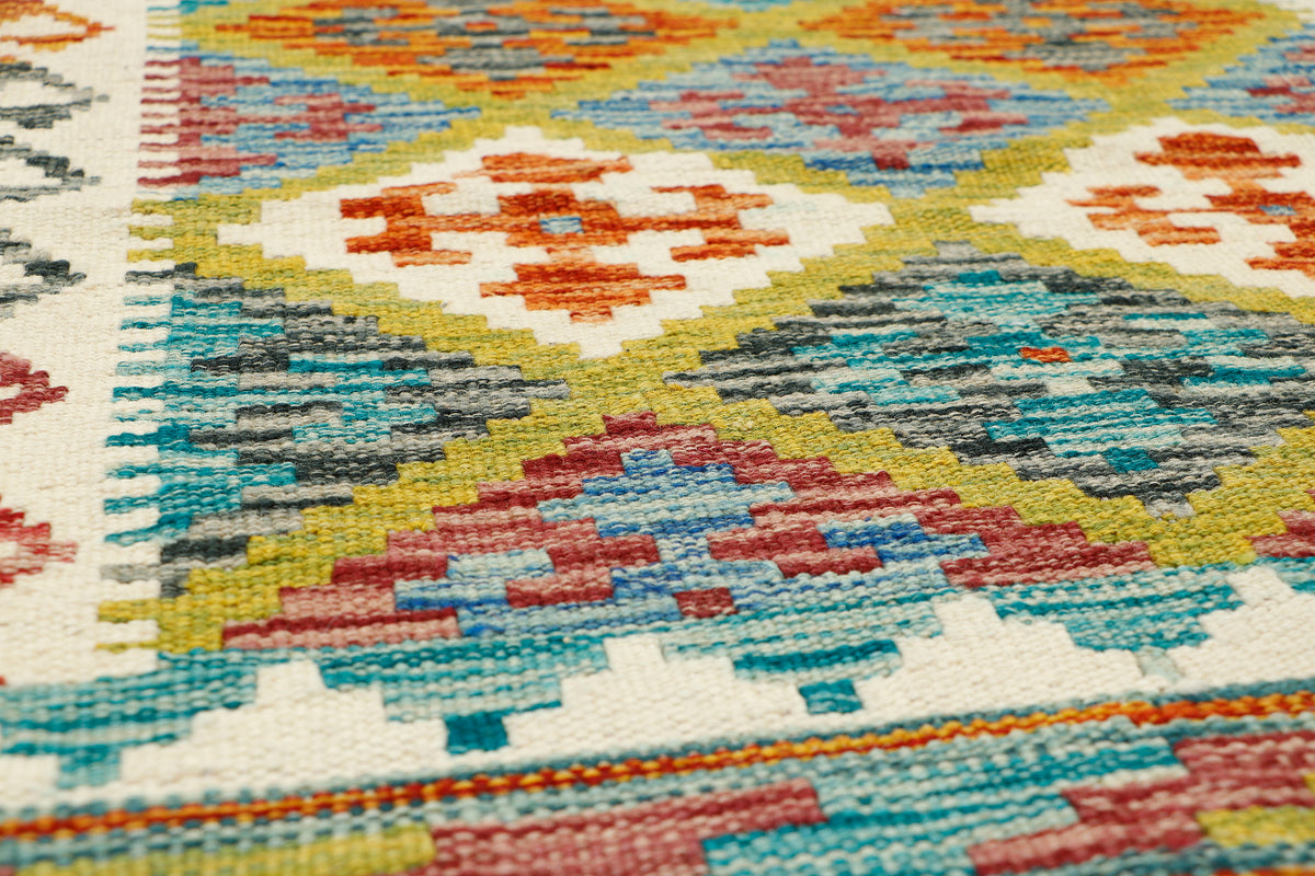 Afghan Kilim runner rug by eastofhere, 149x65cm, featuring vibrant geometric patterns and traditional handwoven craftsmanship.