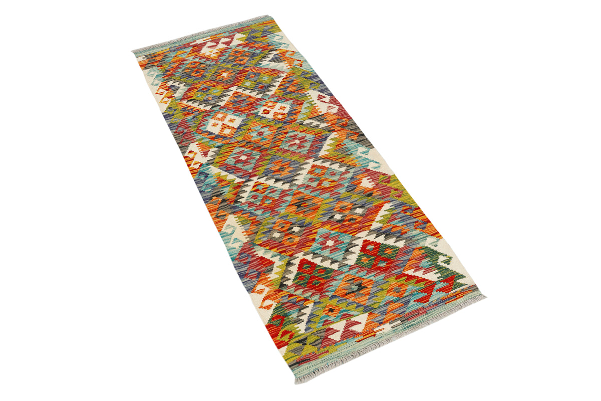 Afghan Kilim runner rug by eastofhere, featuring vibrant geometric patterns in earthy tones, measuring 145x59cm.