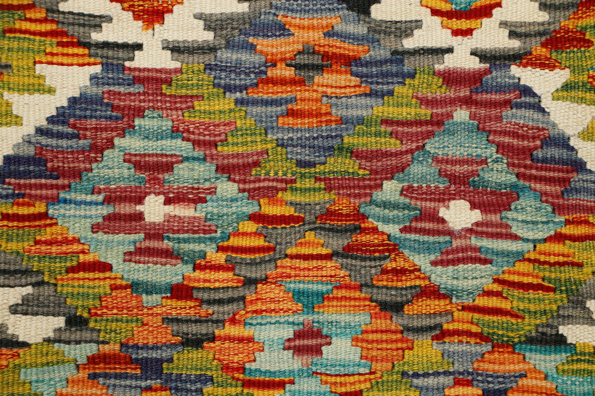 Afghan Kilim runner rug by eastofhere, 145cm long and 59cm wide, with colorful traditional geometric patterns on a woven textile.