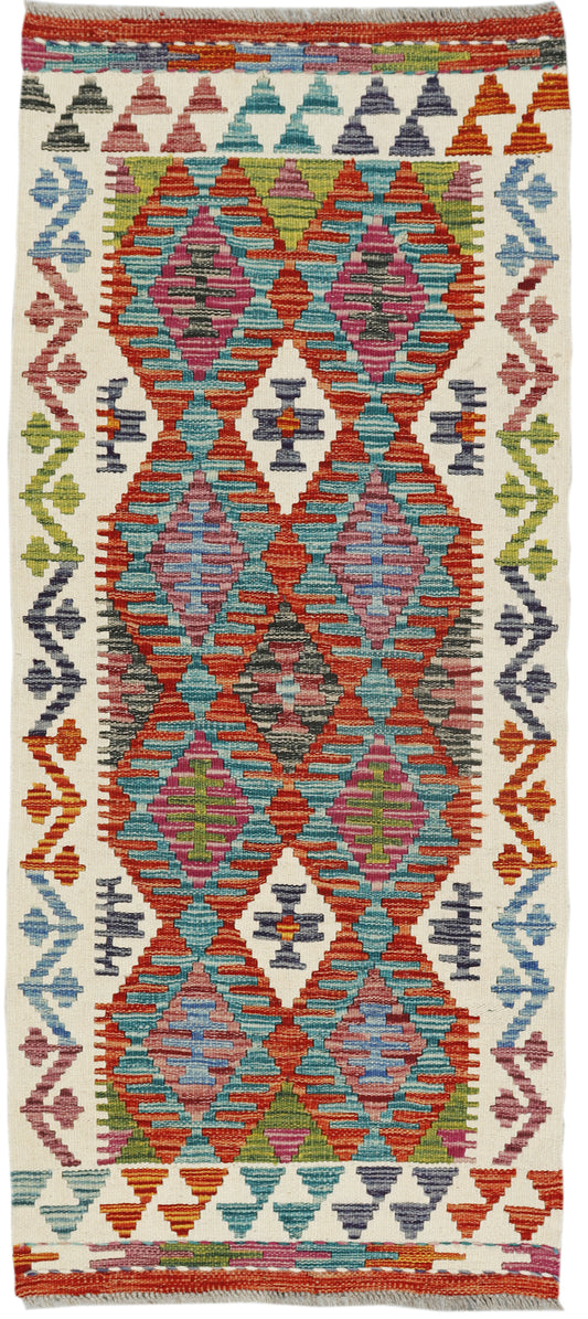 Afghan Kilim runner rug by eastofhere, 149x64cm, featuring traditional geometric patterns and vibrant colors on woven fabric.