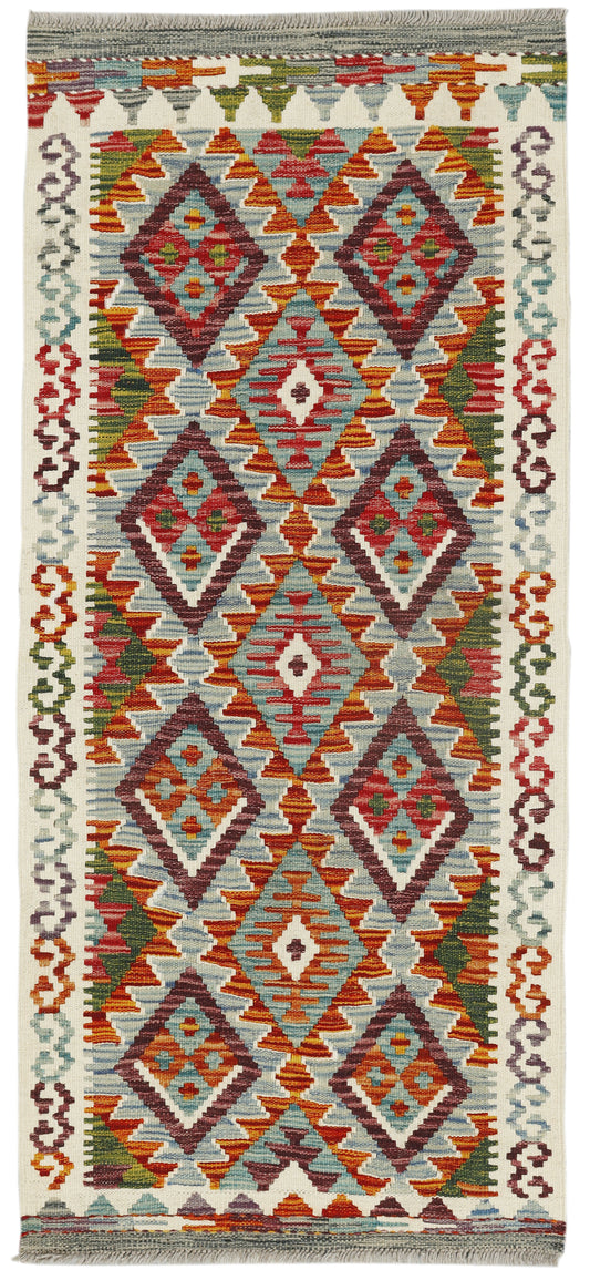 Afghan Kilim runner rug by eastofhere, 150cm x 65cm, featuring traditional geometric patterns in vibrant colors.