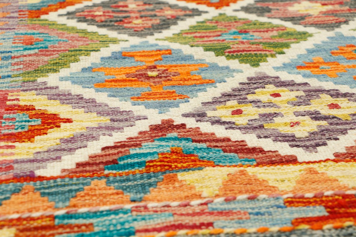 Afghan Kilim rug runner by eastofhere, 152 x 62cm, featuring traditional geometric patterns and vibrant colors on woven fabric.