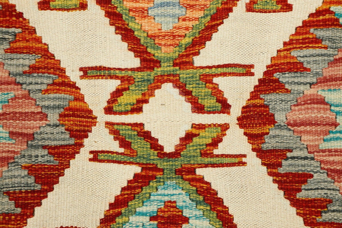 Afghan Kilim runner rug by eastofhere, 164x66cm, featuring traditional geometric patterns and vibrant colors on a woven textile.