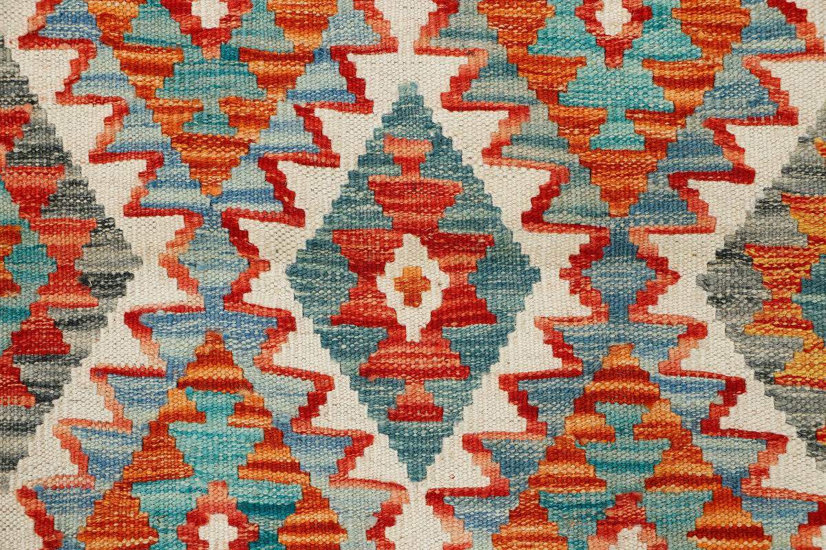 Afghan Kilim rug runner by eastofhere, 158x68cm, featuring traditional geometric patterns and vibrant colors on woven textile.