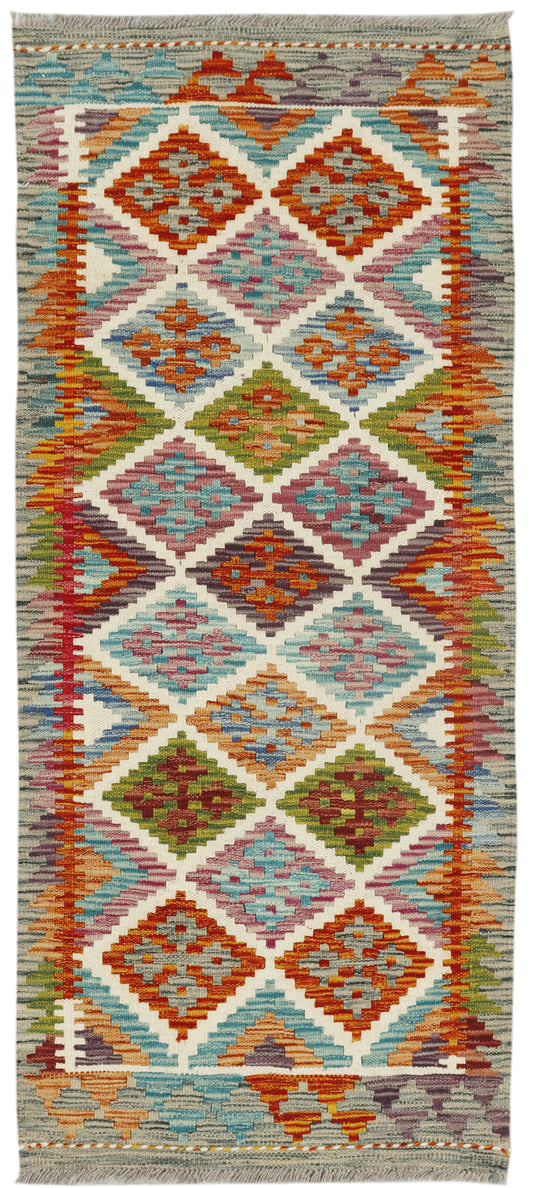Afghan Kilim runner rug by eastofhere, 140x60cm, featuring traditional geometric patterns in vibrant colors, woven textile design.