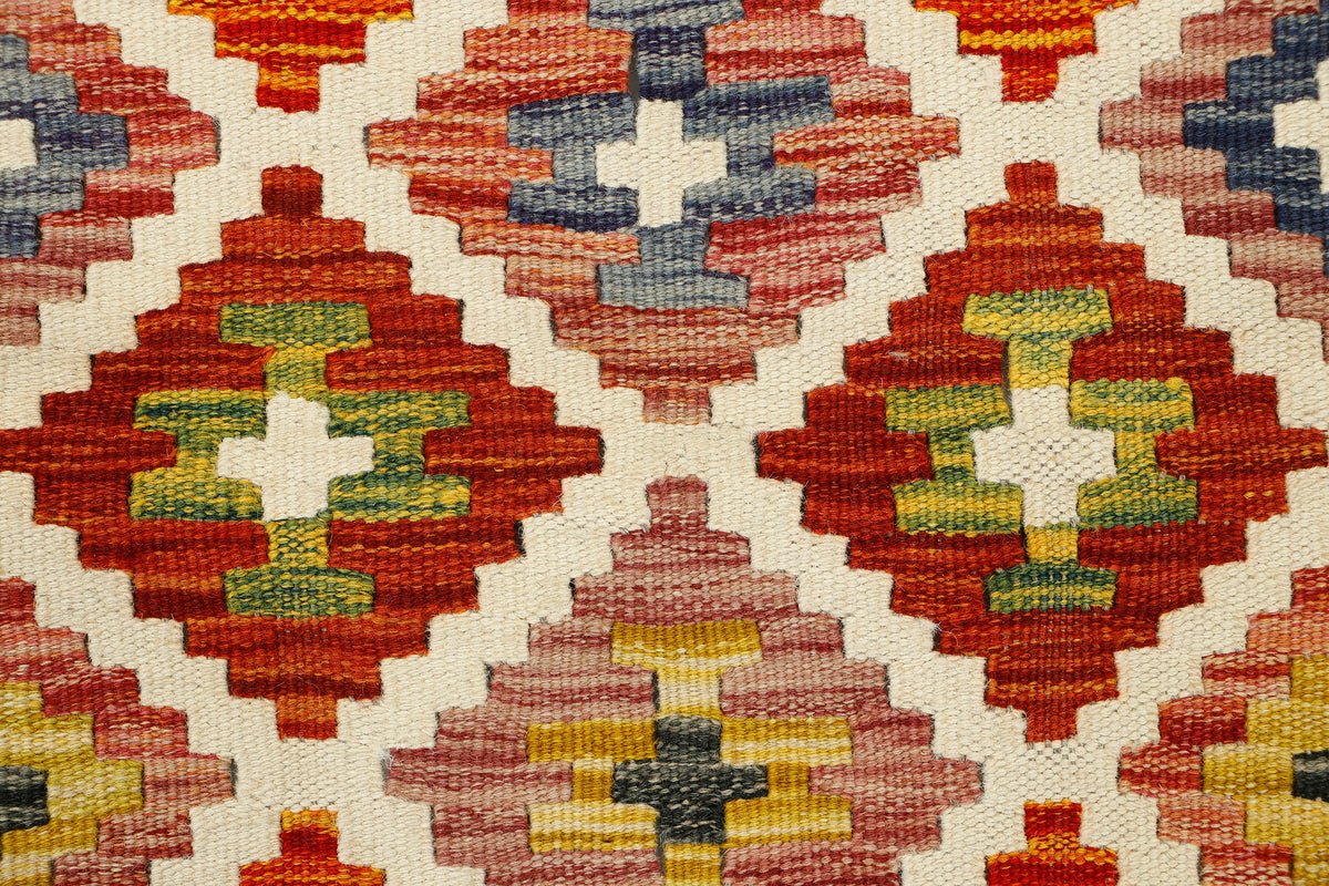 Afghan Kilim runner rug by eastofhere, 150cm long and 64cm wide, with colorful traditional geometric patterns on a woven textile.