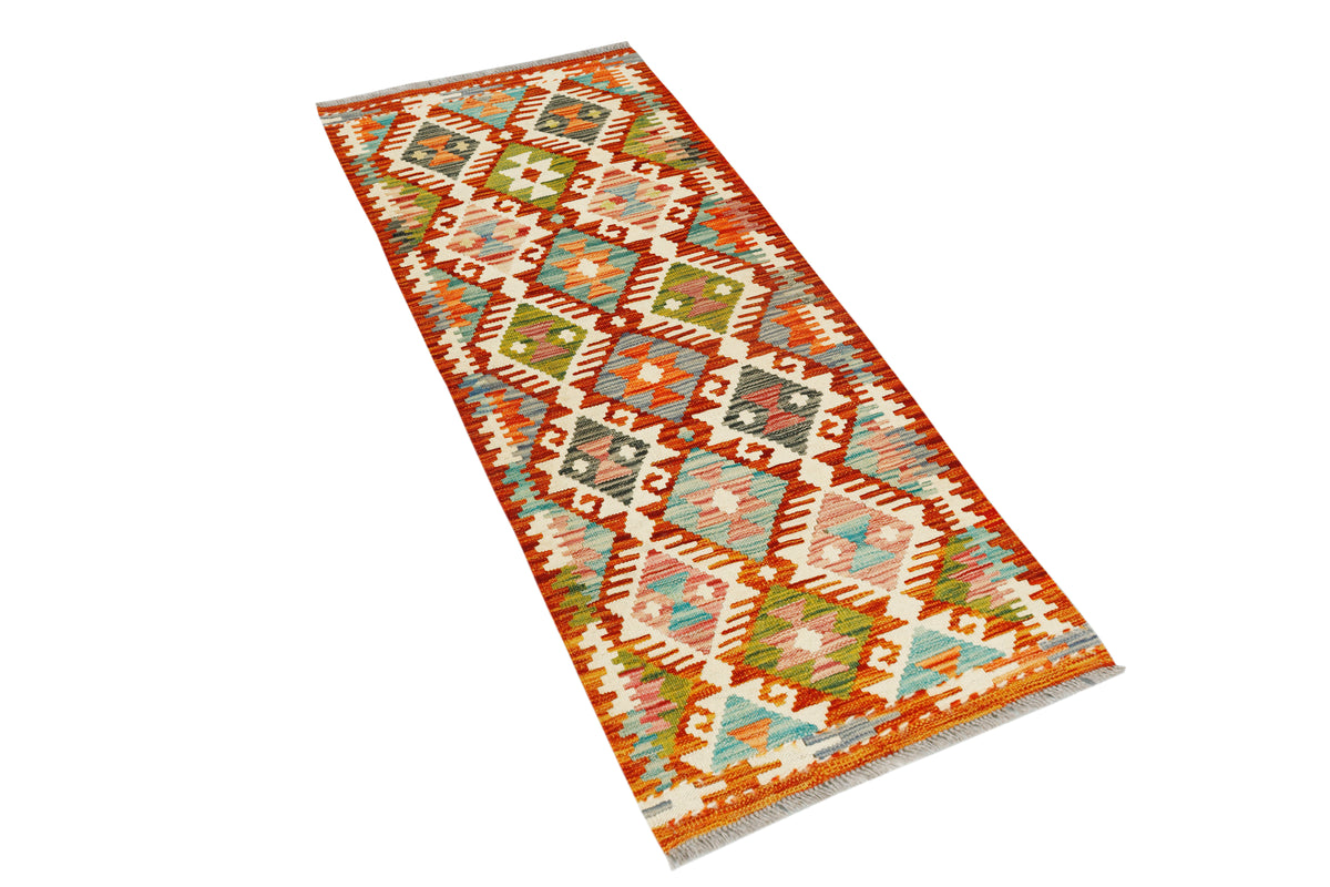 Afghan Kilim runner rug by eastofhere, 145x57cm, featuring traditional geometric patterns and vibrant colors on woven textile.