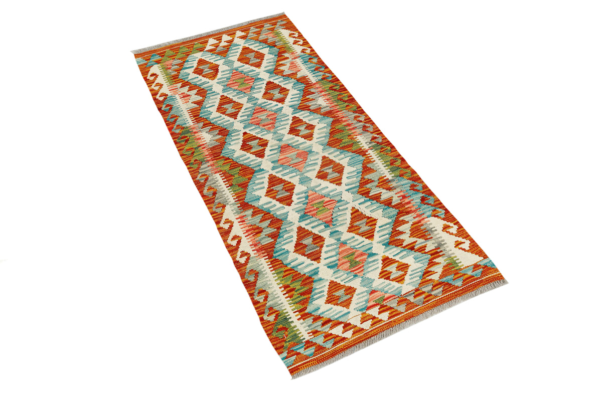 Afghan Kilim runner rug by eastofhere, 133x63cm, featuring traditional geometric patterns and vibrant colors on woven fabric.