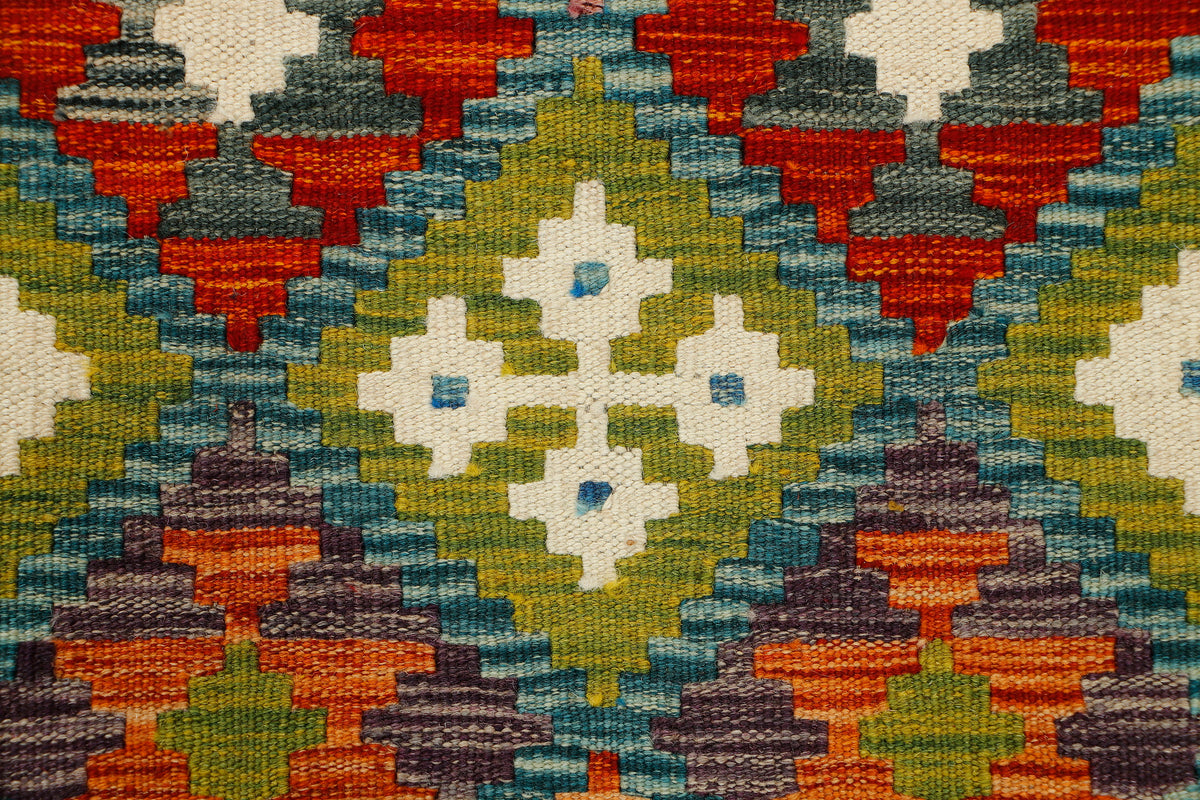 Afghan Kilim runner rug by eastofhere, 150cm x 65cm, featuring traditional geometric patterns and vibrant colors.