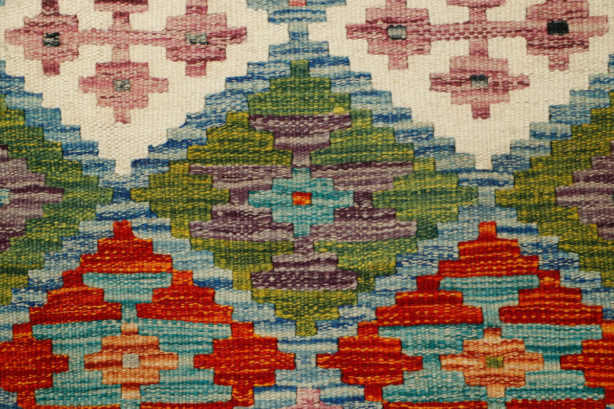 Afghan Kilim runner rug by eastofhere, 153x66cm, featuring colorful geometric patterns on a woven textile background.