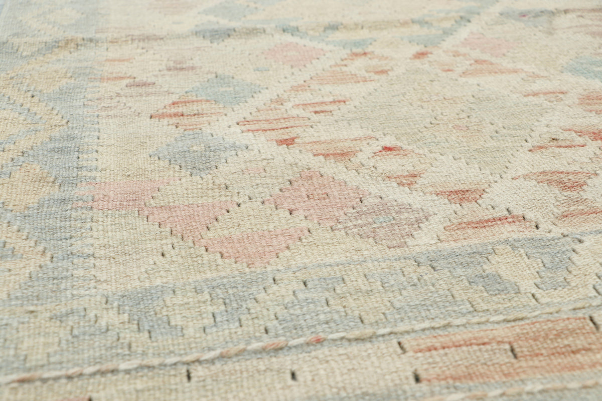 Afghan Kilim runner rug by eastofhere, 239x76cm, featuring traditional geometric patterns and vibrant colors on woven fabric.