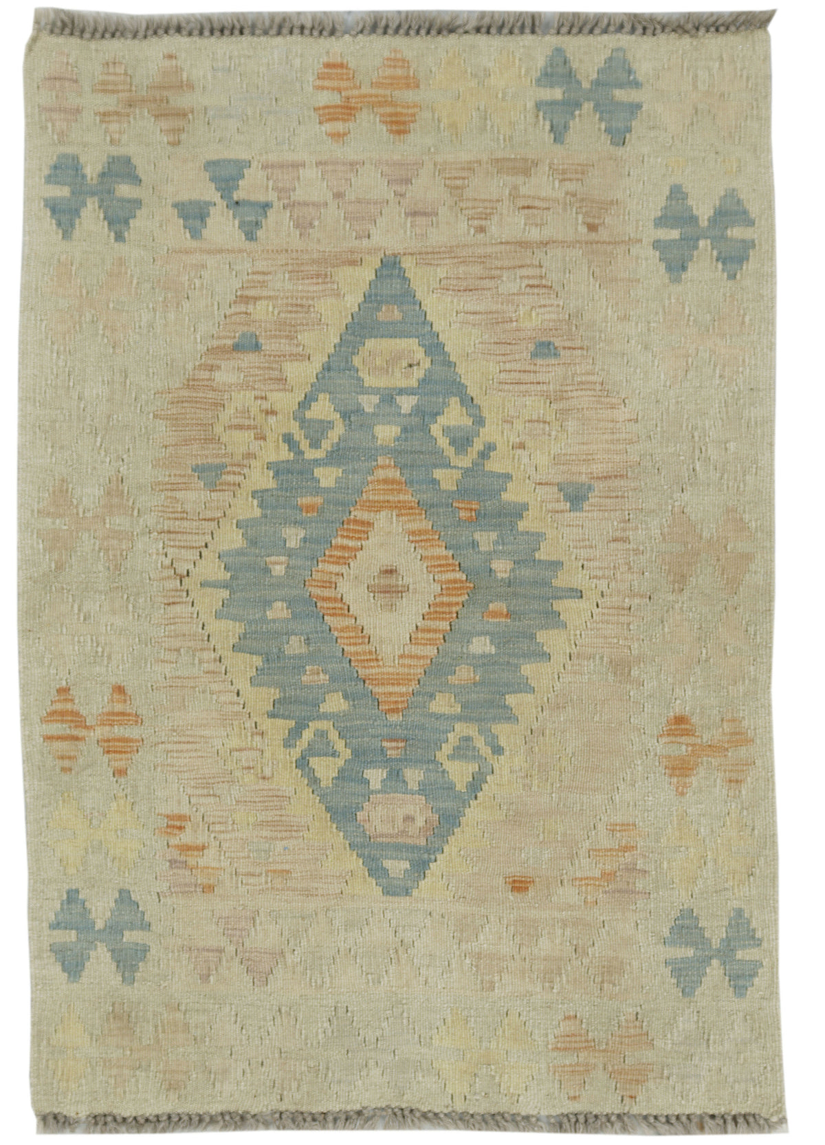 A square woven rug with a Southwestern geometric pattern in beige, light blue, and terracotta orange, featuring a central diamond medallion and fringe on the top and bottom edges.
