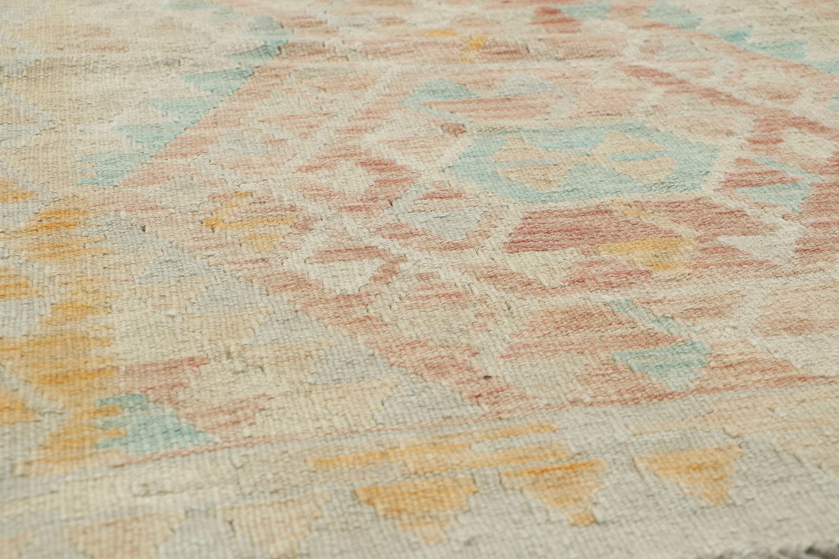 Colorful Afghan Kilim rug by eastofhere, 118x76cm, featuring traditional geometric patterns and vibrant woven designs.