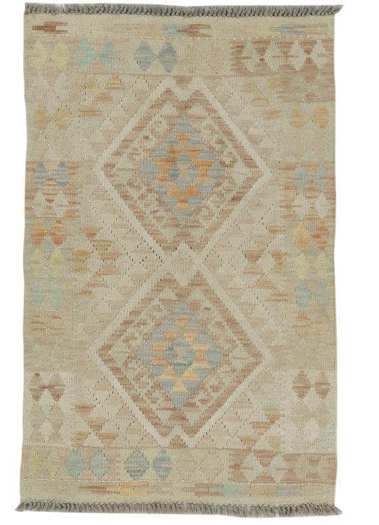 Afghan Kilim rug by eastofhere, 115x72cm, featuring traditional geometric patterns in vibrant colors on a woven textile background.