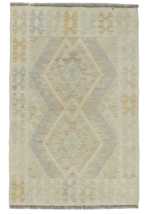 Afghan Kilim rug by eastofhere, 115x75cm, with traditional geometric patterns and vibrant colors, showcasing intricate handcrafted weaving.