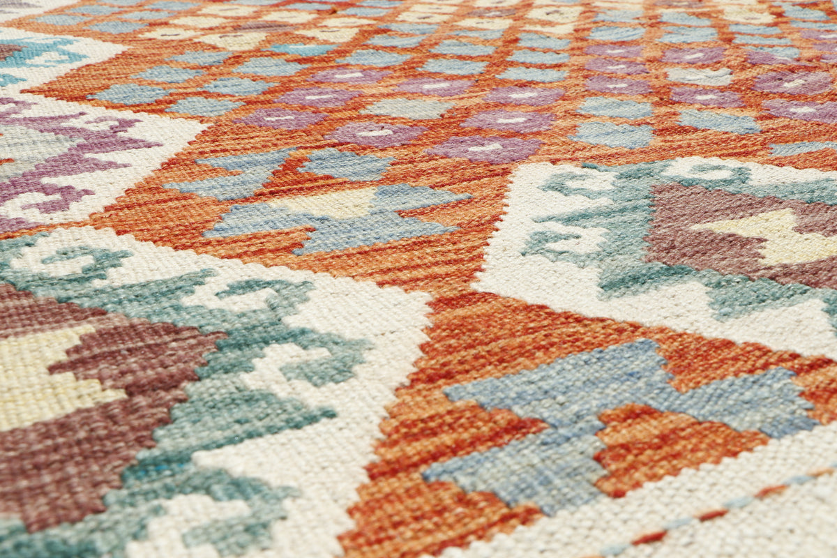 Afghan Kilim rug with geometric patterns, 200x156cm, by eastofhere, showing vibrant colors and traditional woven design.