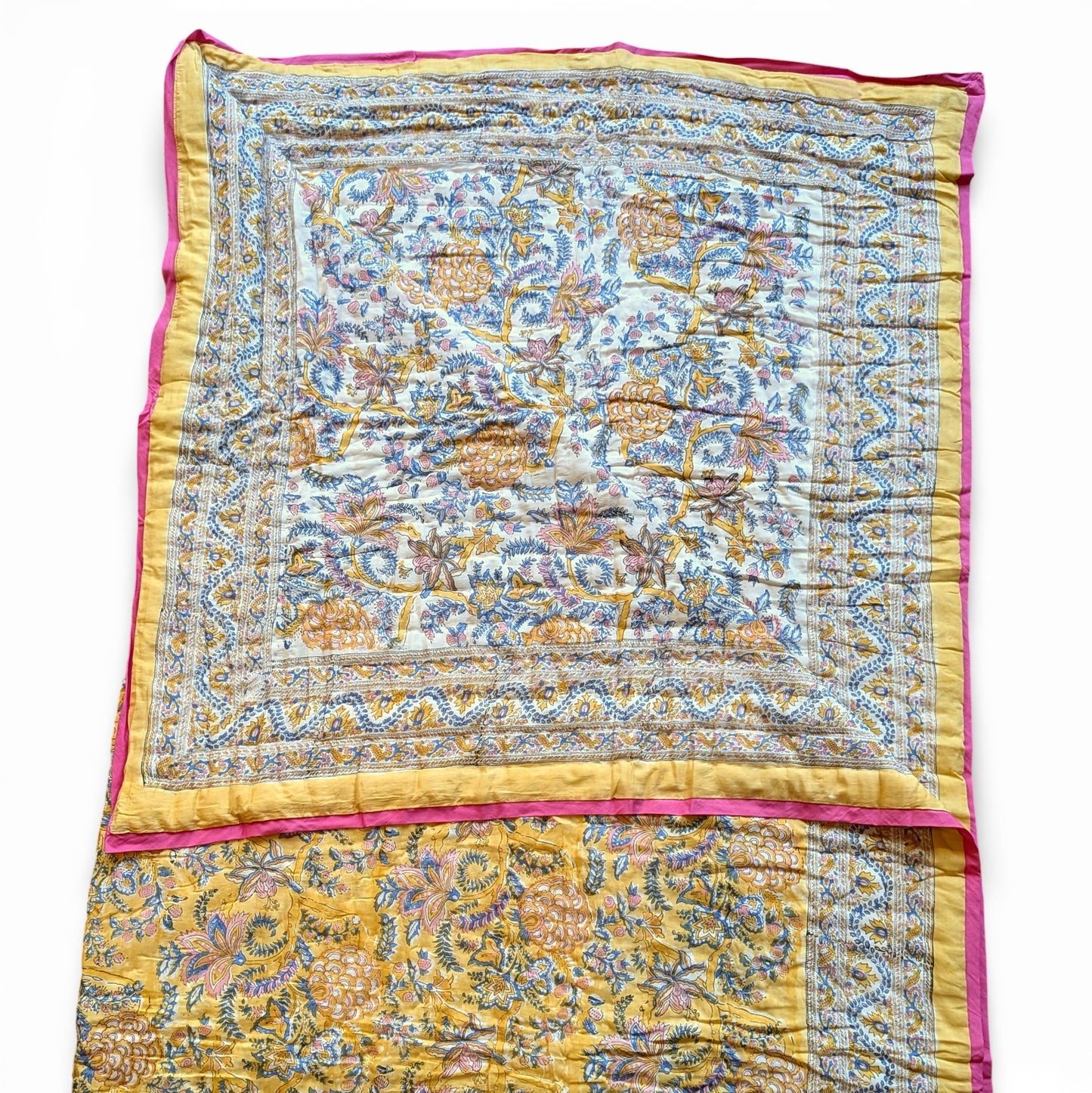 Colorful patterned fabric with yellow and pink border on a white background