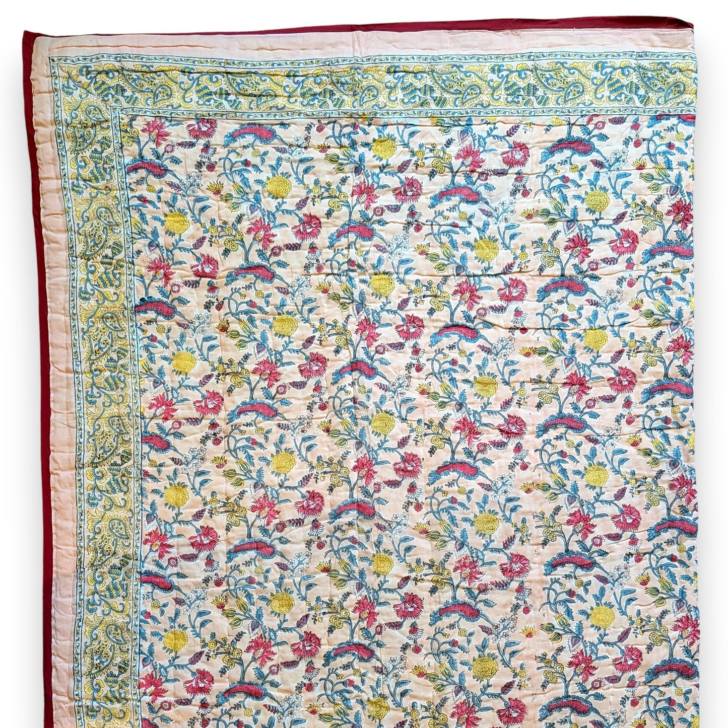 Colorful floral patterned fabric with intricate designs on a white background