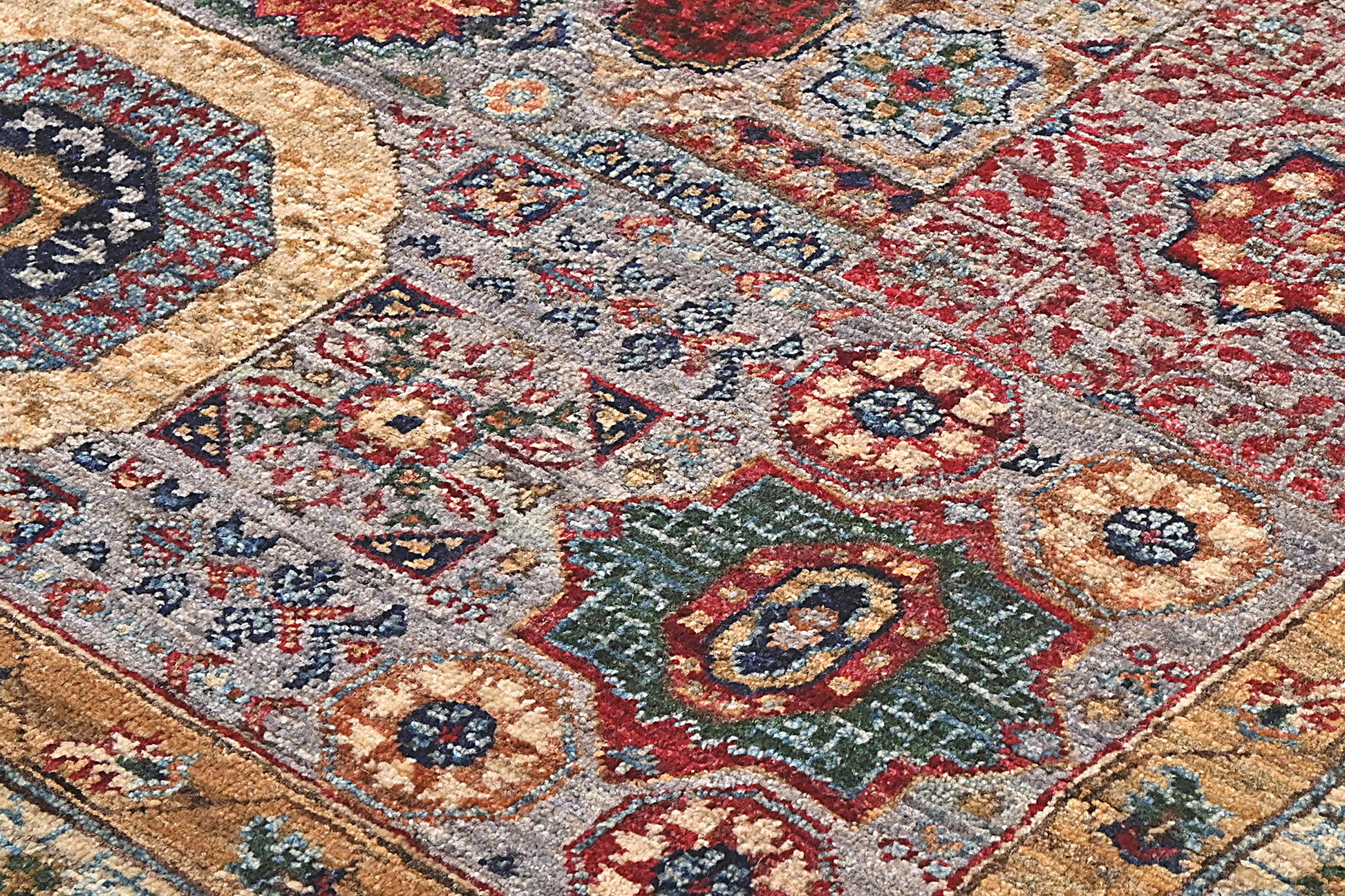 Close-up of a patterned rug with intricate designs.