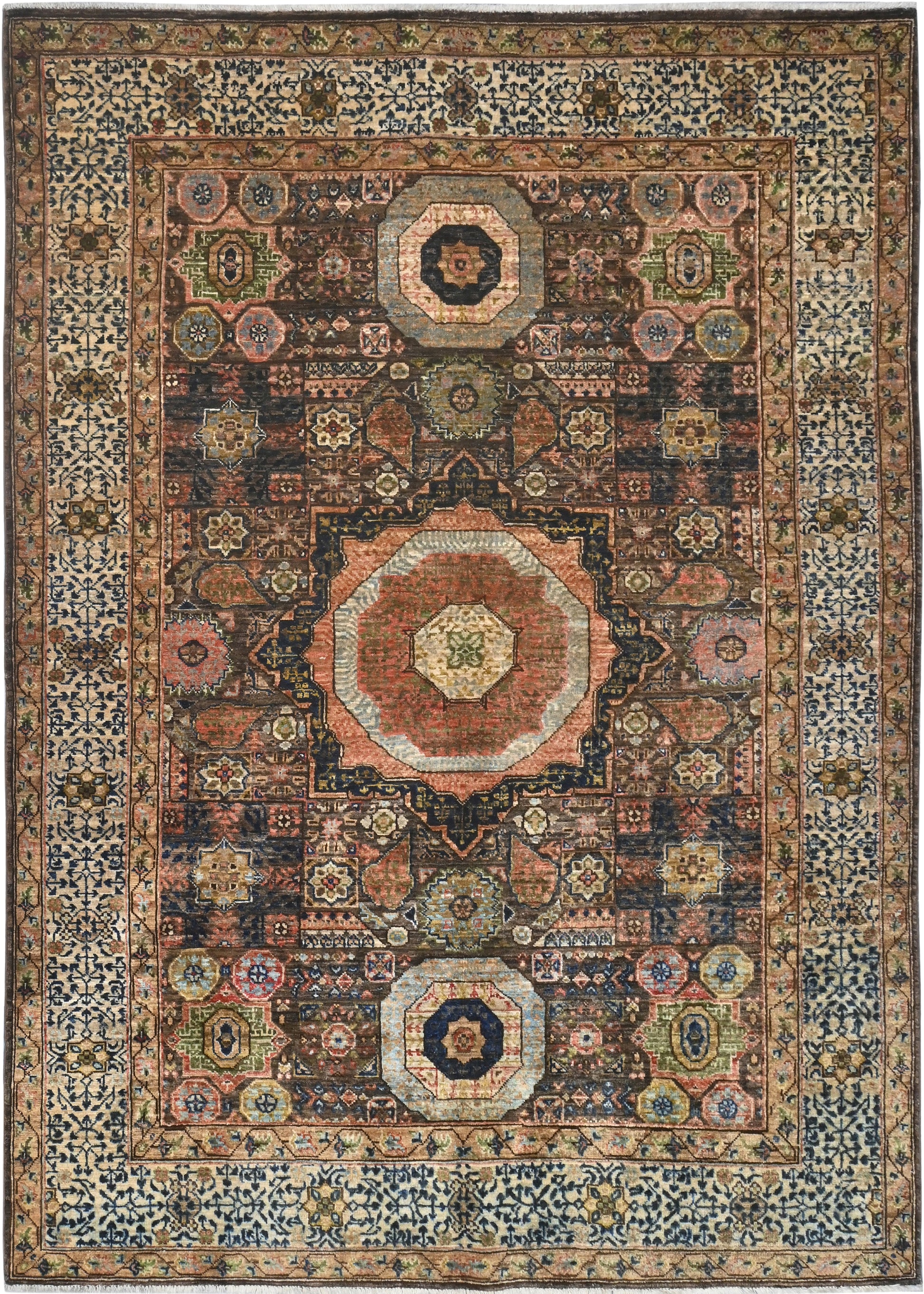 Decorative rug with intricate patterns and colors on a dark background