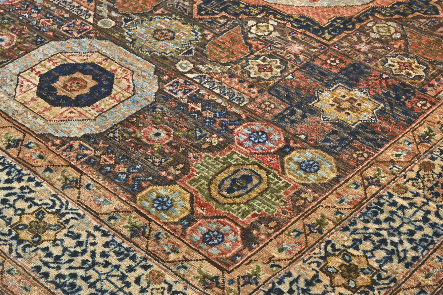 Close-up of a patterned rug with intricate designs.