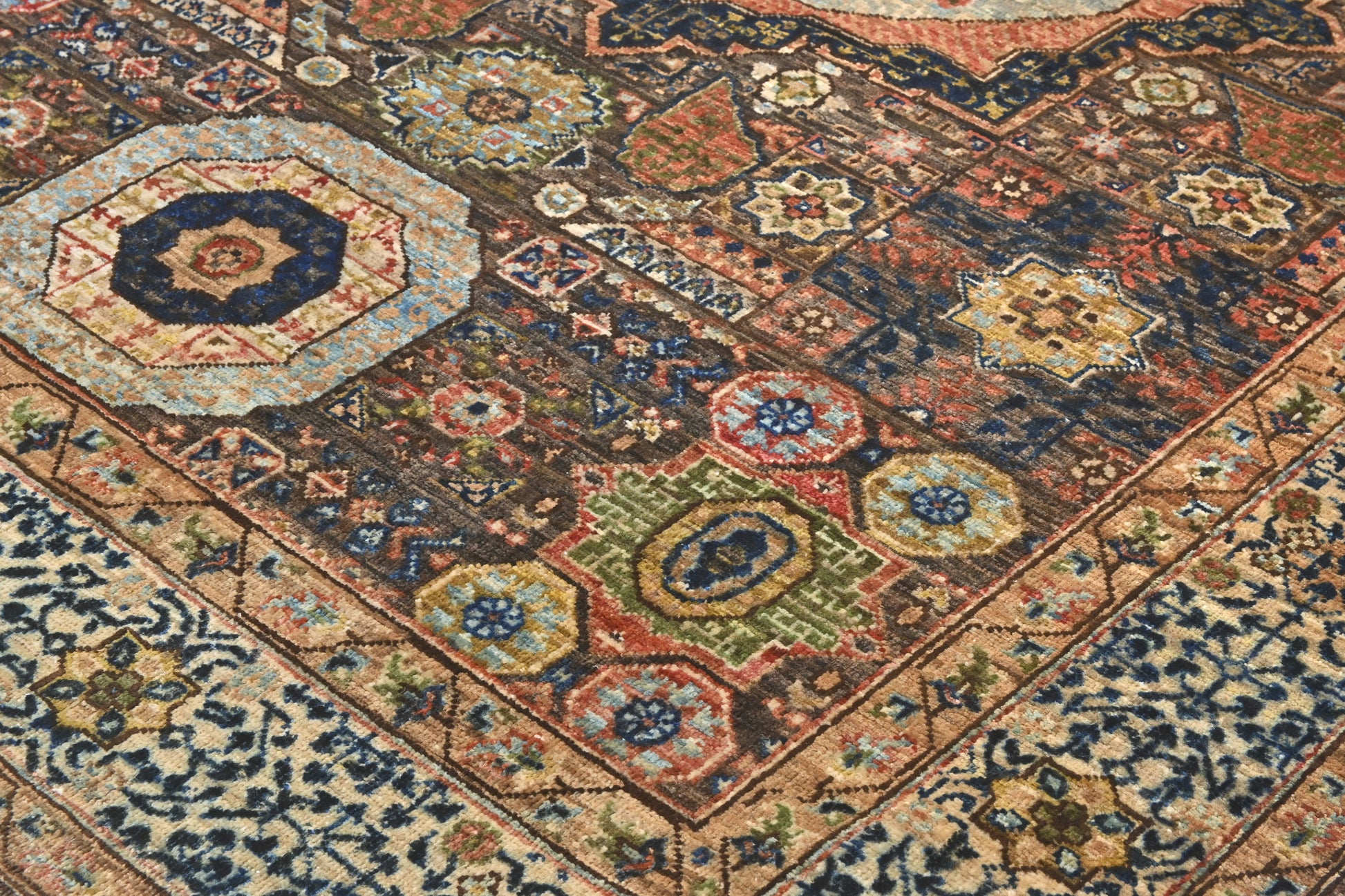 Close-up of a patterned rug with intricate designs.
