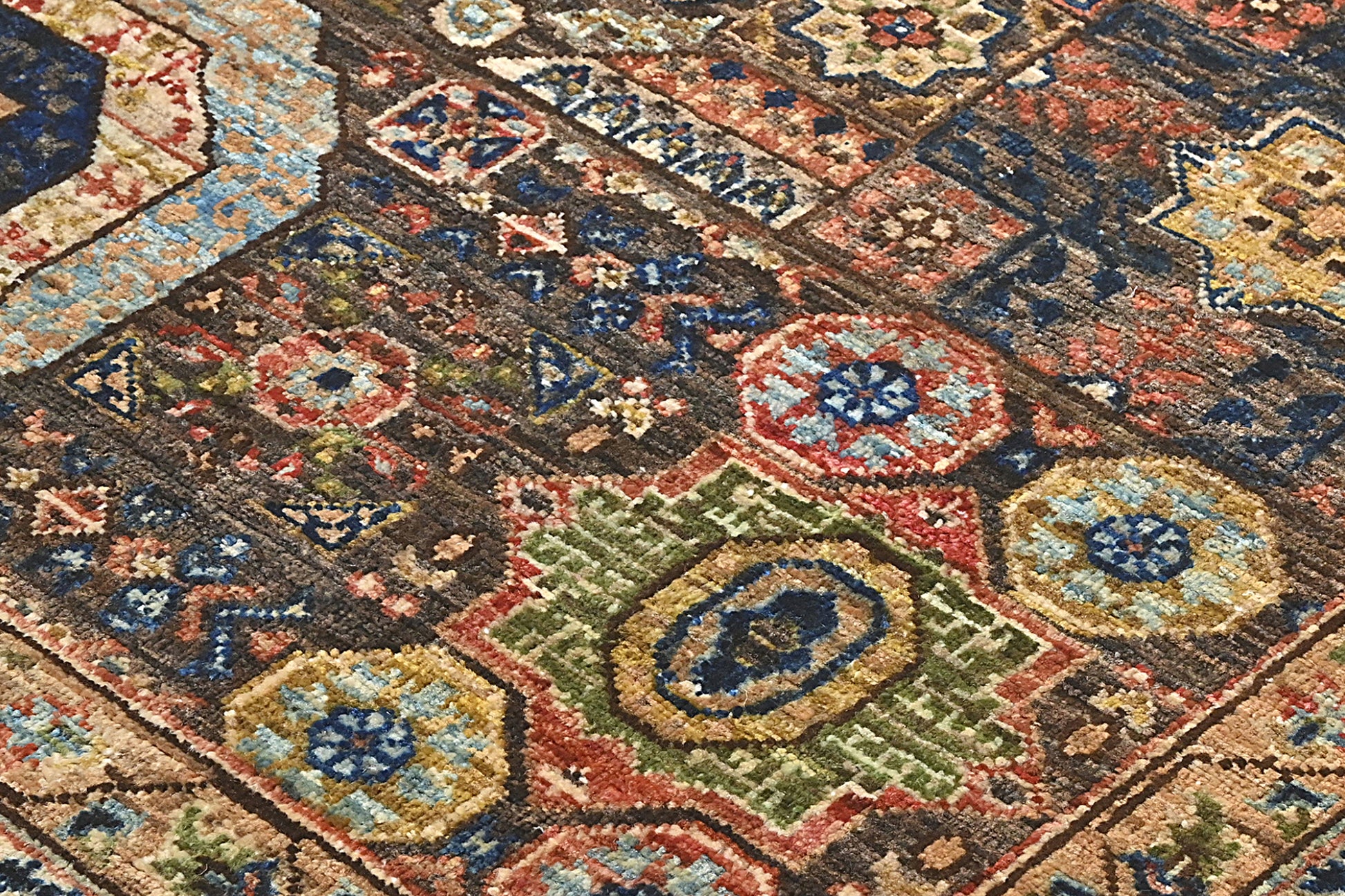 Close-up of a patterned rug with intricate designs.