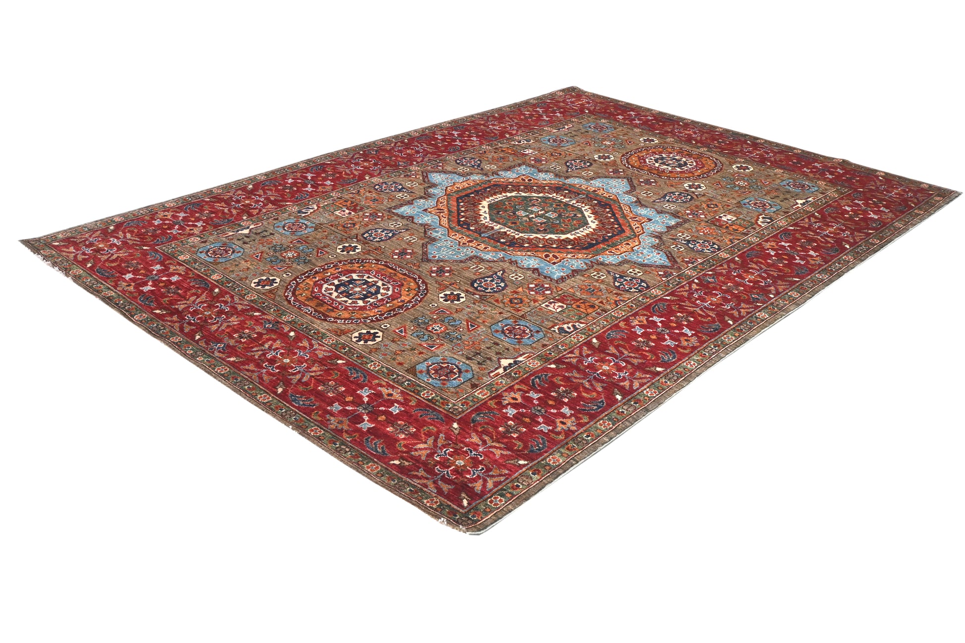 Decorative rug with intricate patterns on a white background