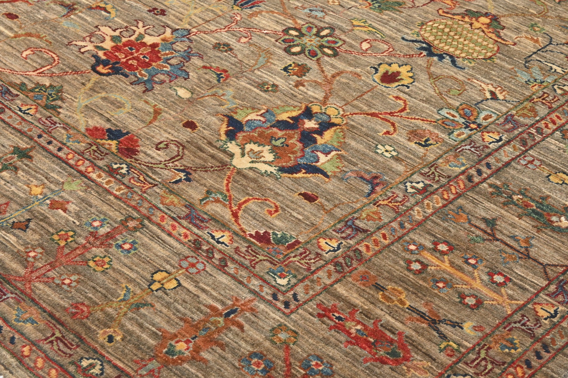 Close-up of an intricately designed rug with floral patterns.