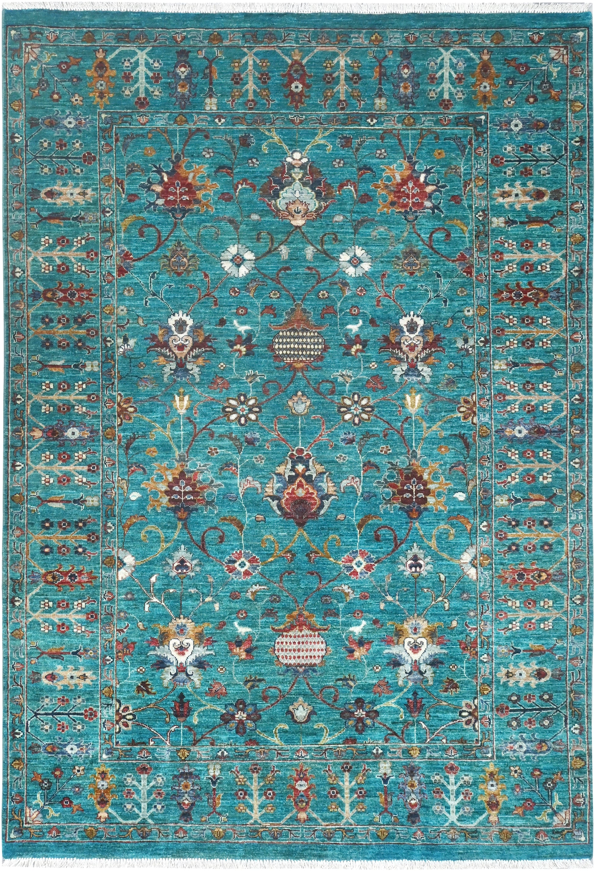 Decorative rug with intricate patterns on a blue background