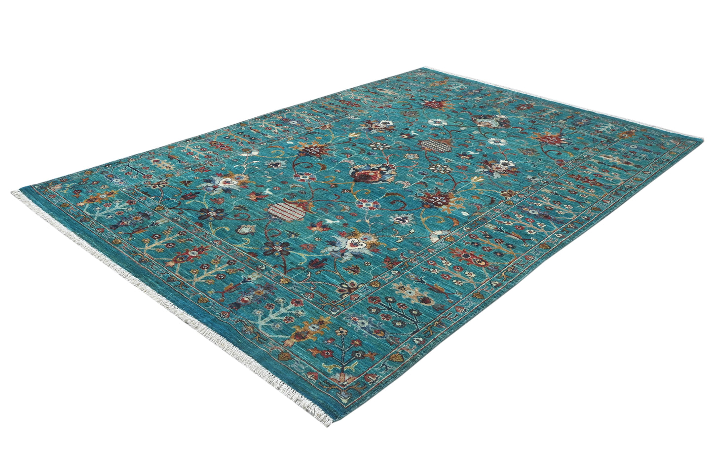 Teal patterned rug on a white background