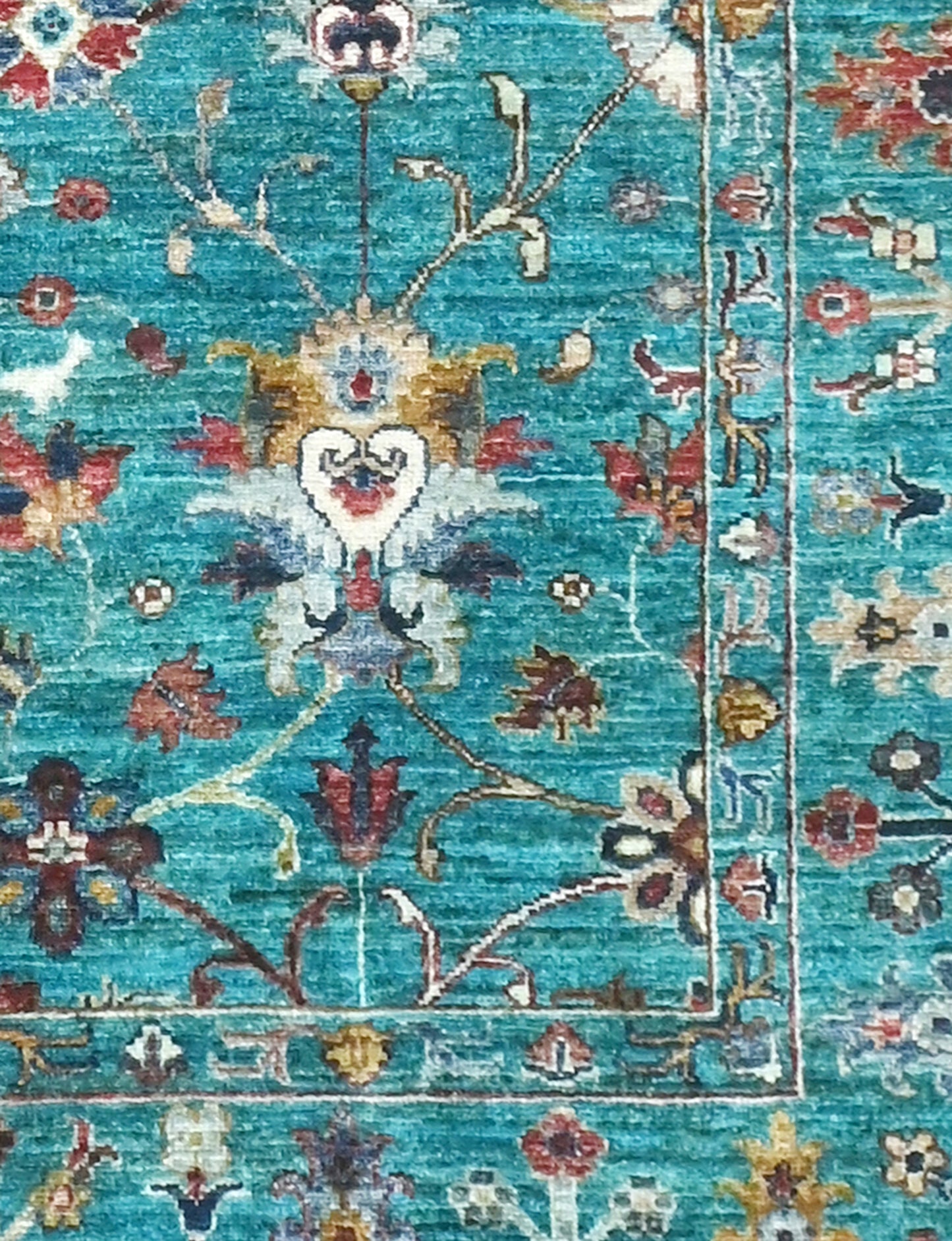 Decorative rug with intricate floral patterns on a blue background