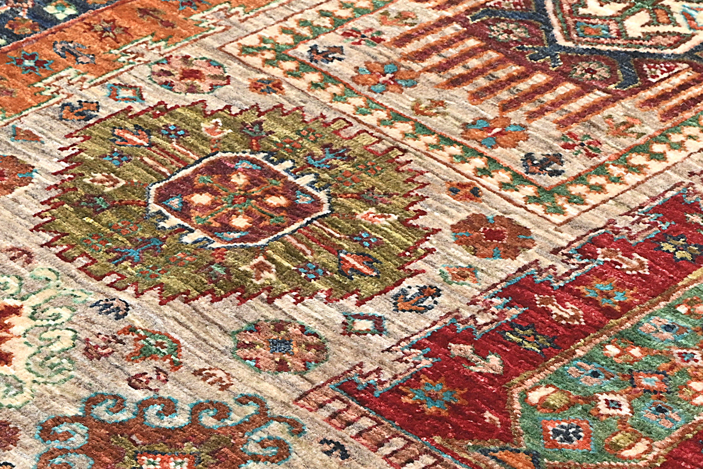 Close-up of a colorful patterned rug with geometric designs.