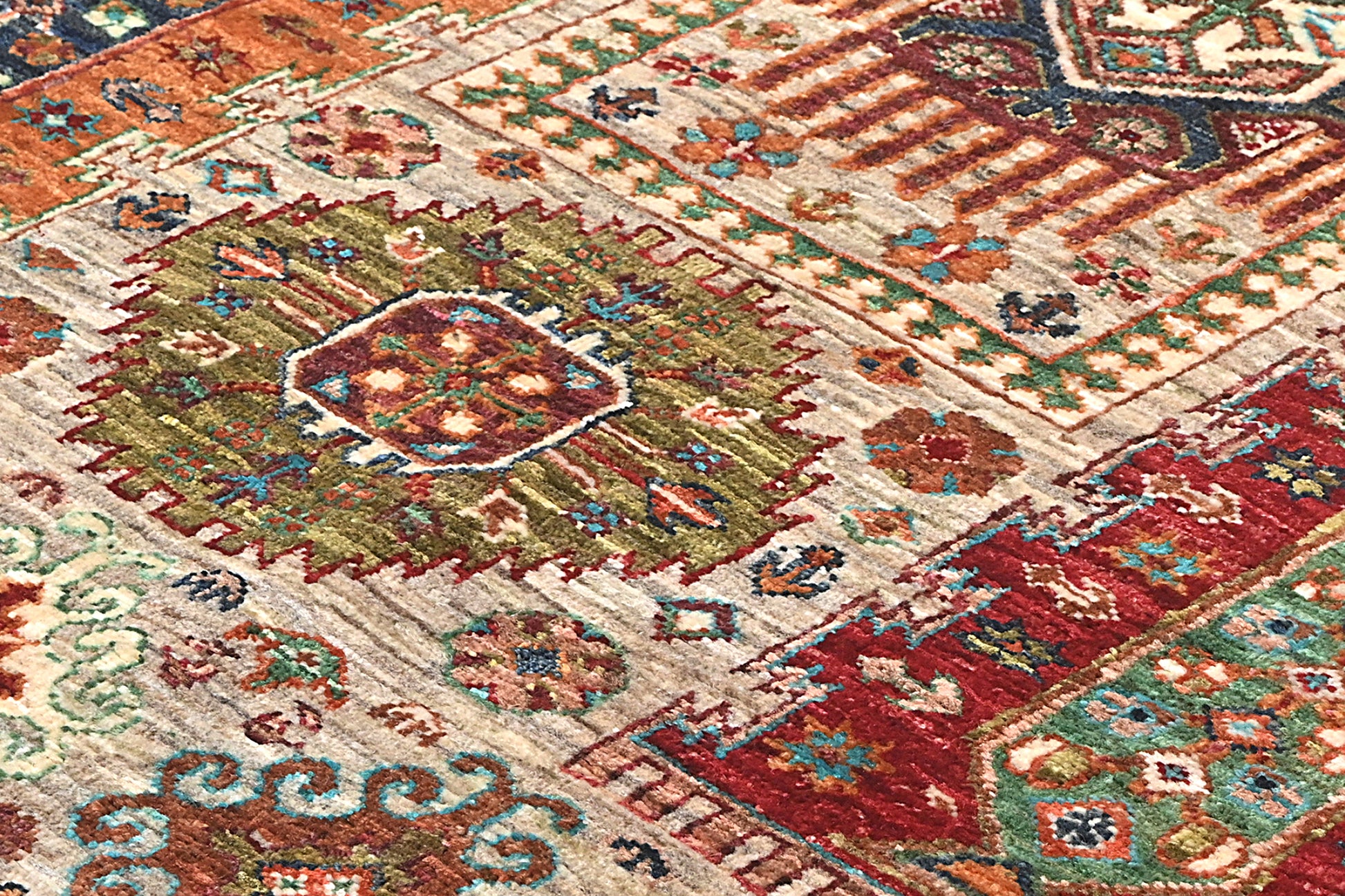 Close-up of a colorful patterned rug with geometric designs.
