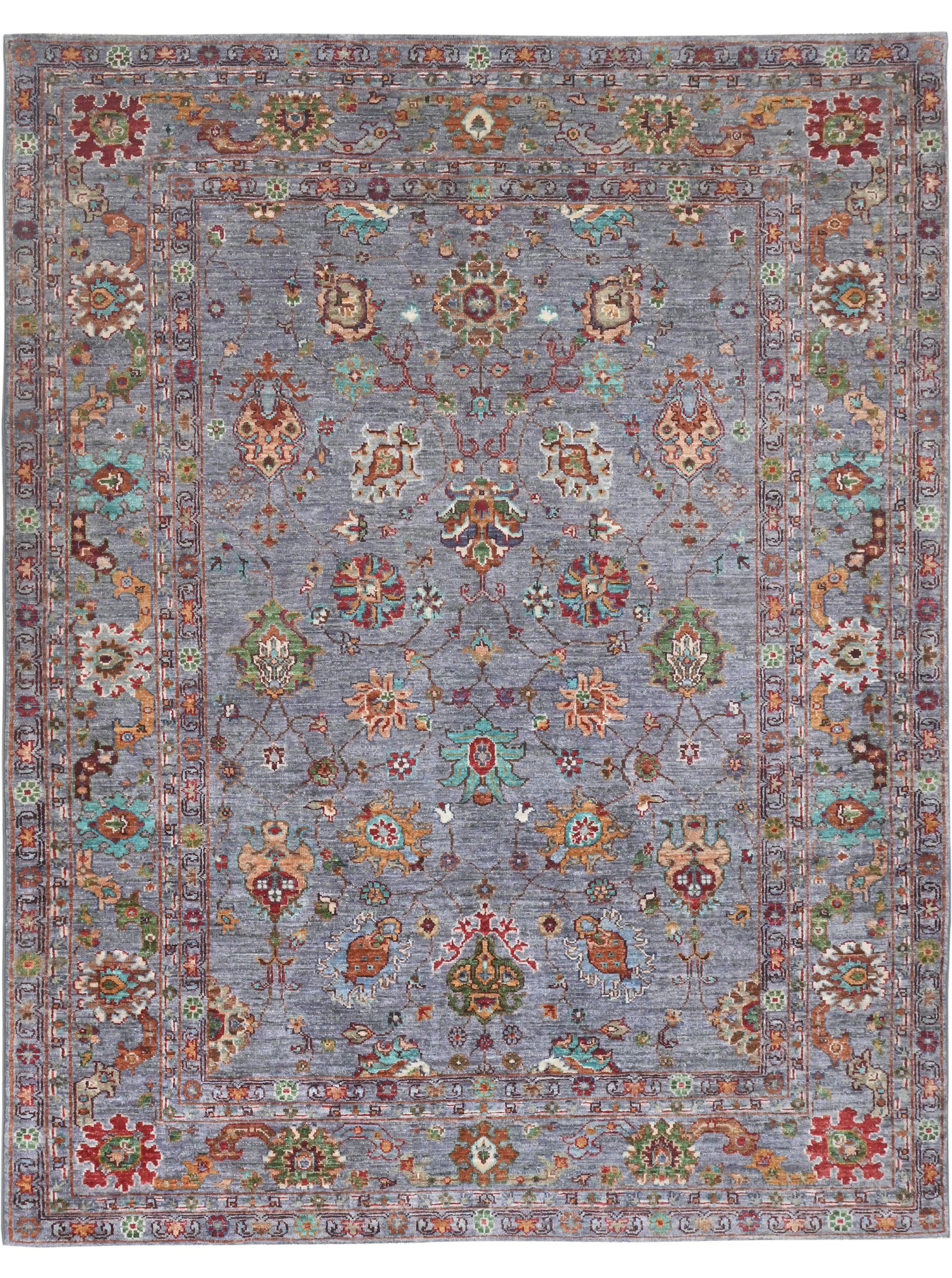 Decorative rug with intricate patterns on a blue background