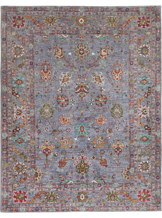 Decorative rug with intricate patterns on a blue background