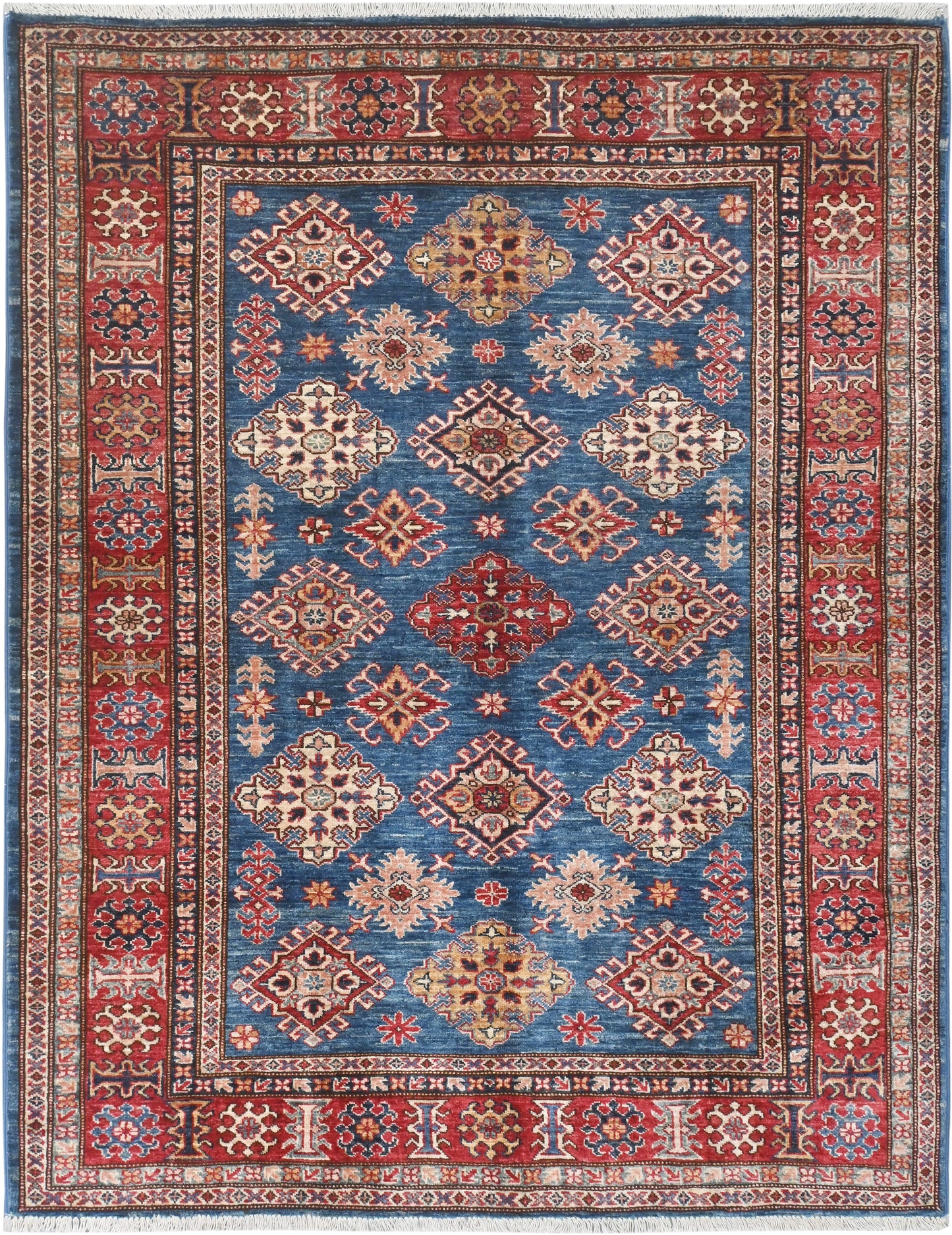 Decorative rug with geometric pattern on a blue background