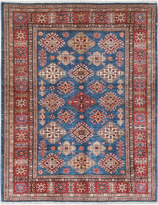 Decorative rug with geometric pattern on a blue background