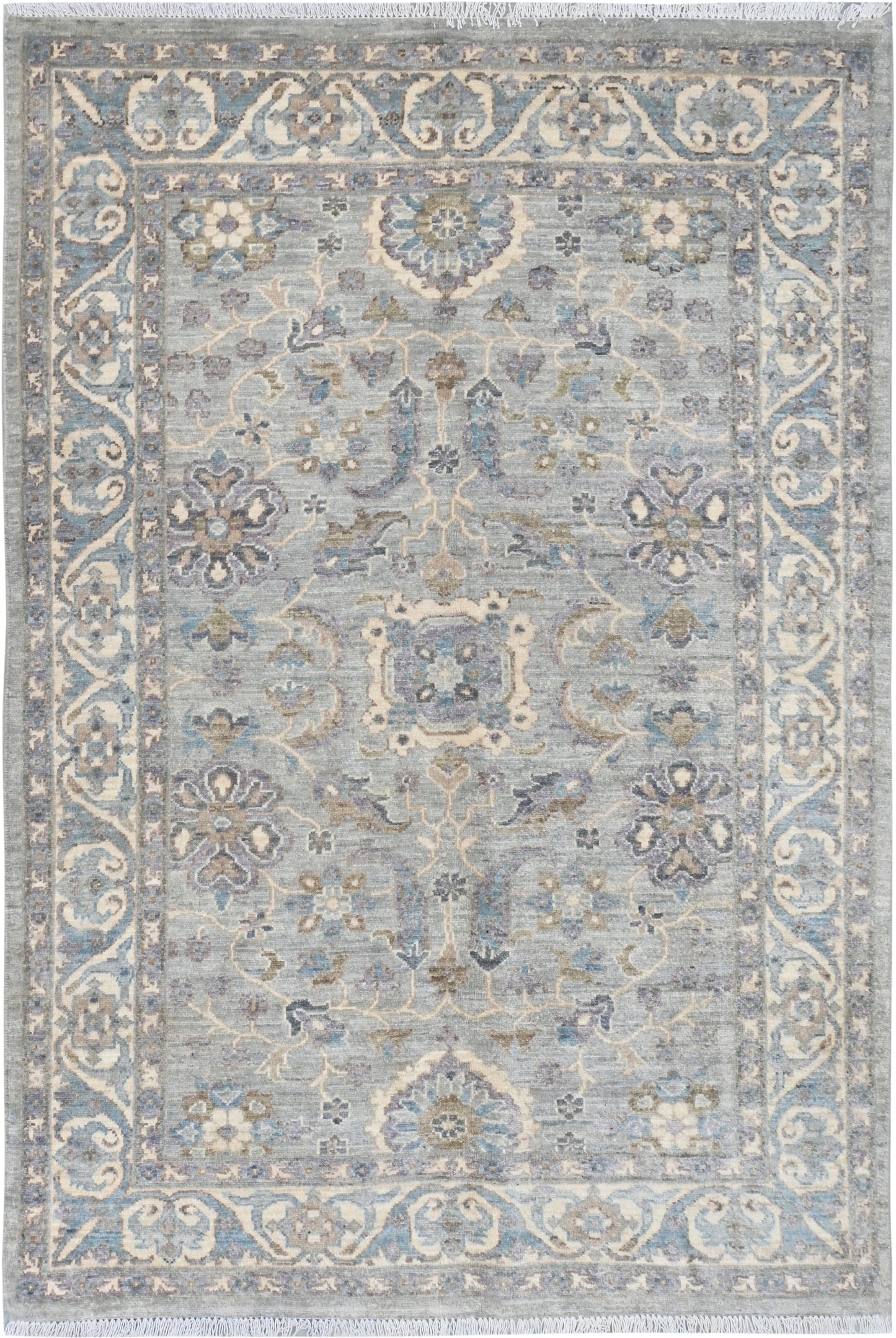 Decorative rug with intricate patterns on a light blue background
