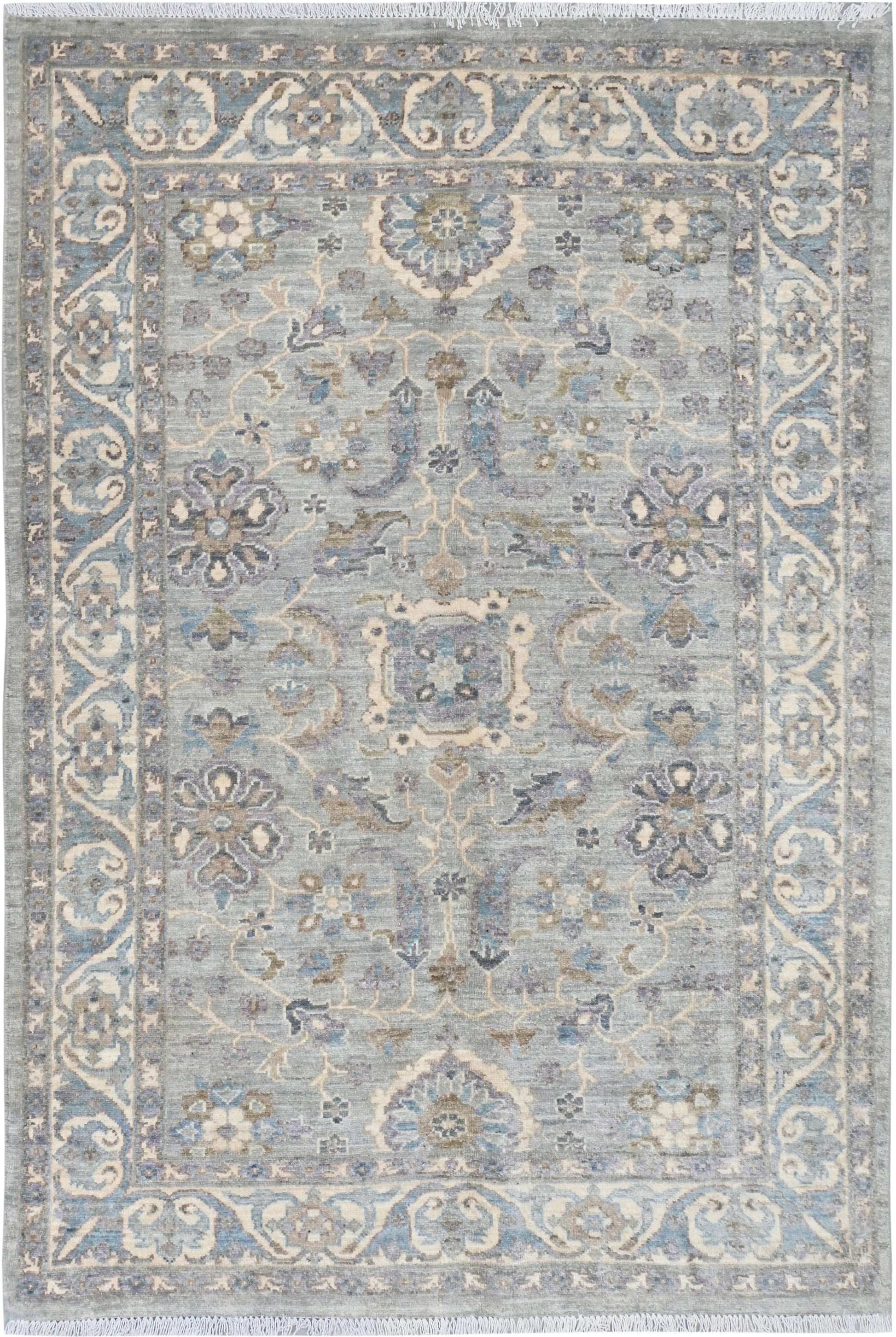 Decorative rug with intricate patterns on a light blue background