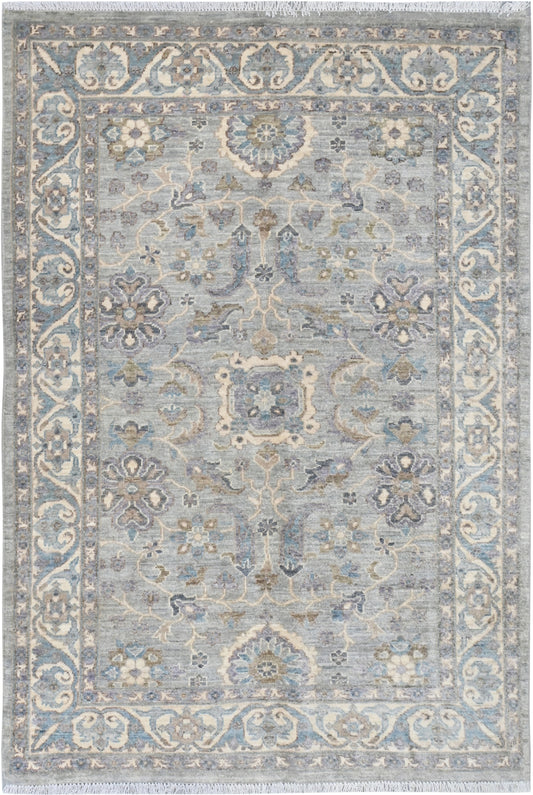 Decorative rug with intricate patterns on a light blue background
