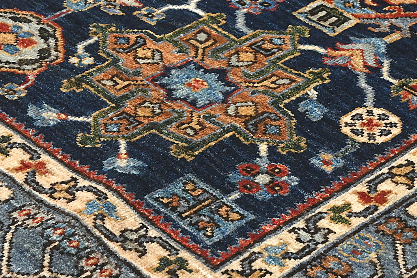Close-up of an intricately designed rug with geometric patterns and vibrant colors.