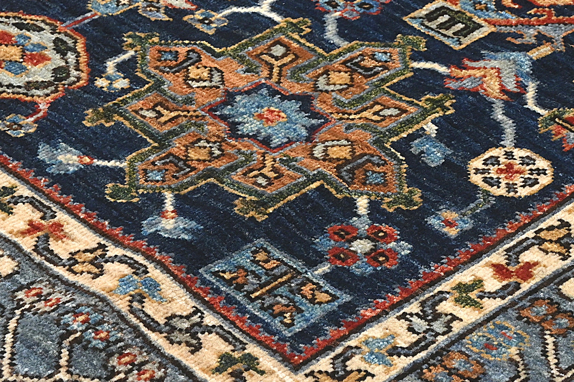 Close-up of an intricately designed rug with geometric patterns and vibrant colors.