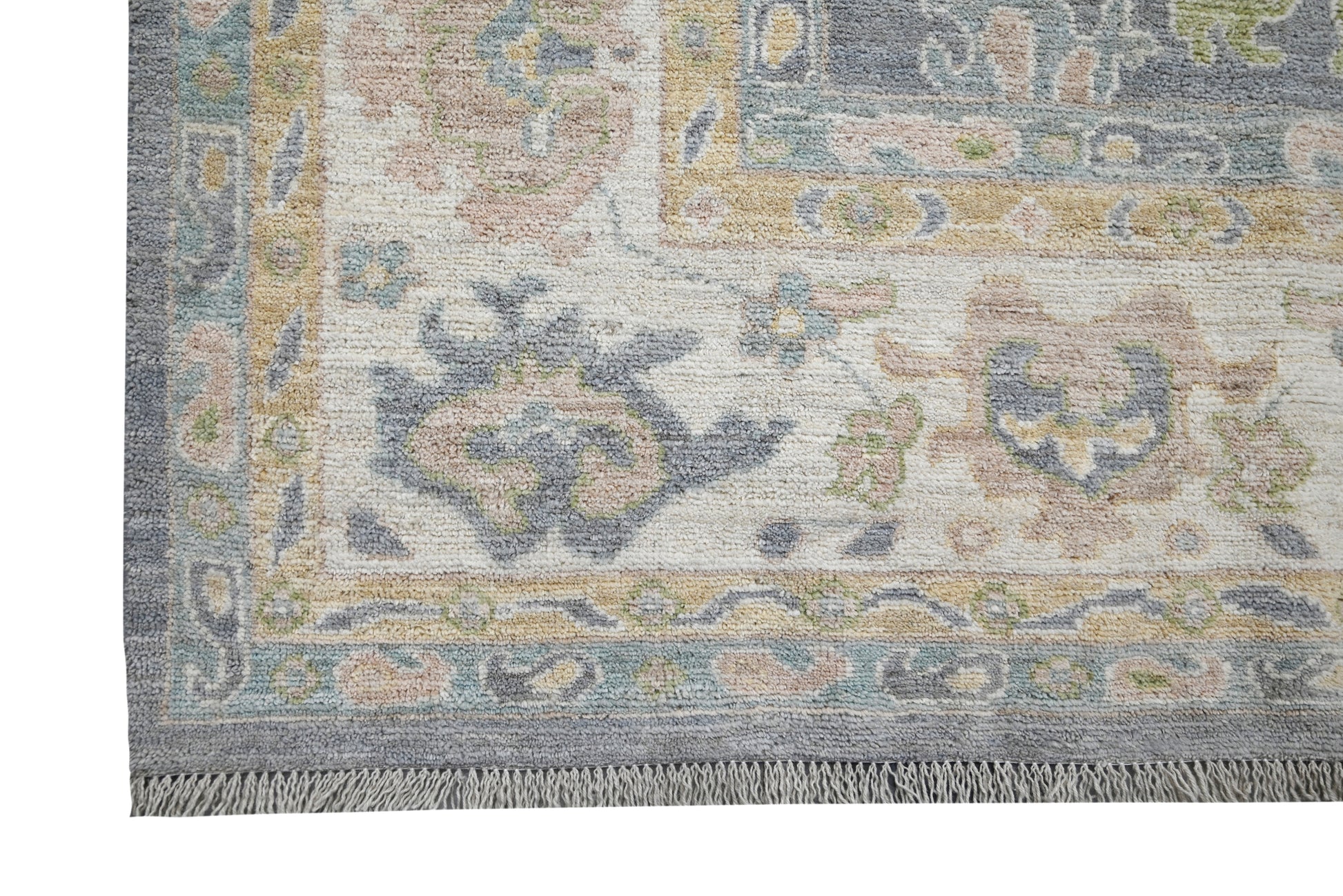 Decorative rug with intricate patterns and colors on a plain background