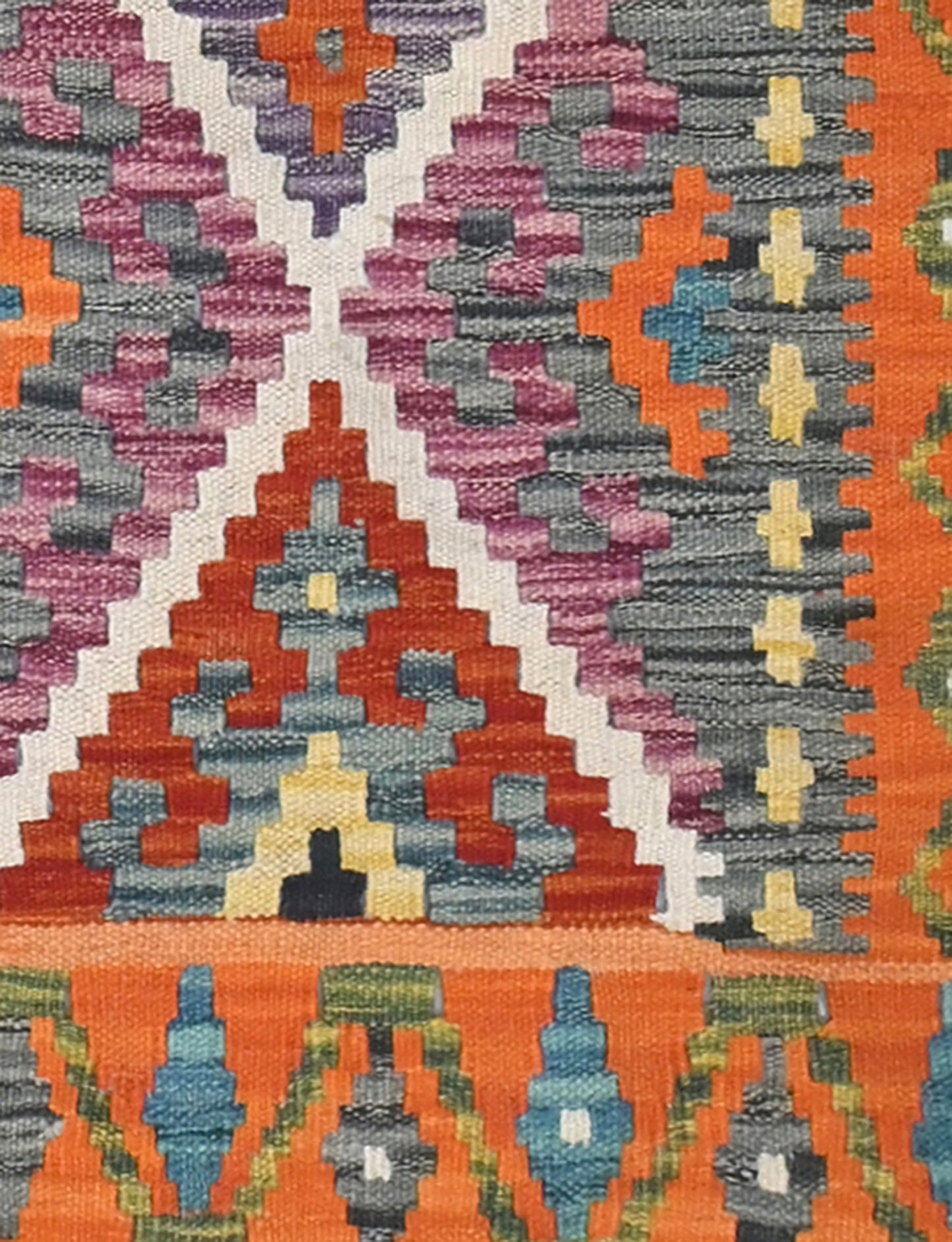Close-up of a colorful patterned fabric with geometric designs.